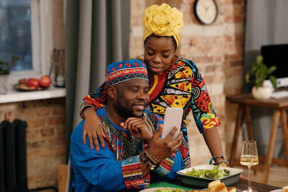 A family shares Kwanzaa food during Kwanzaa holiday celebration/Photo by Courtesy